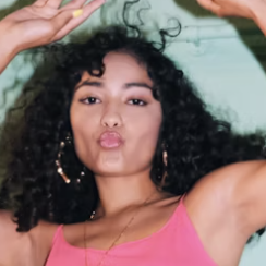 Woman blowing kiss at camera