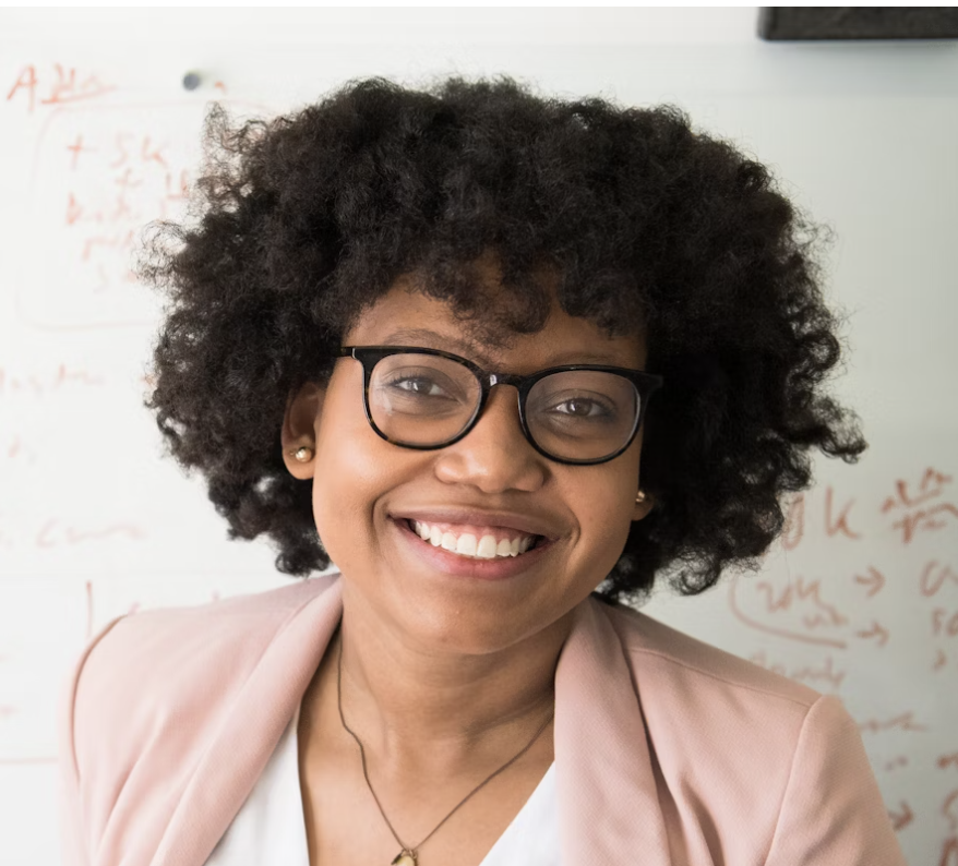 Black woman with glasses smiling